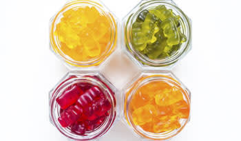 Gummy vitamins in clear glass jars
