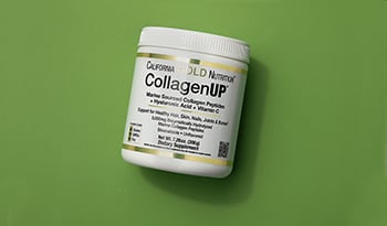 Collagen supplement bottle on green background