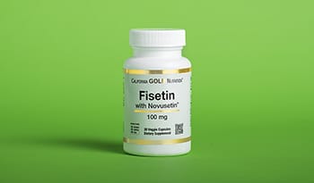 Fisetin supplement on green background