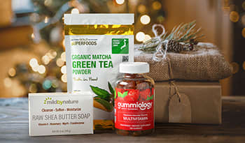 Healthy holiday gift basket with soap, matcha tea, and multivitamins