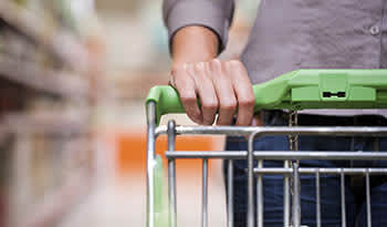 Close up of hand on a shopping cart 