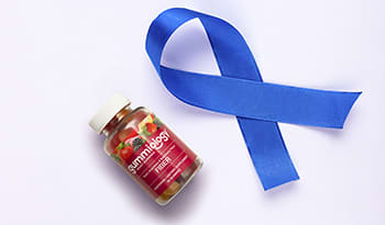 Colon cancer awareness blue ribbon on white background with fiber supplement