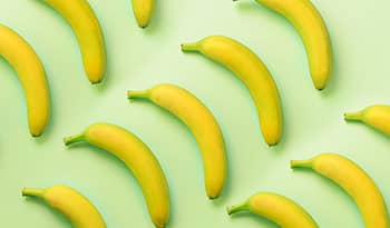 Bananas on a green background