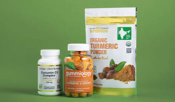 Turmeric supplements in powder, gummy, and capsule form on green background