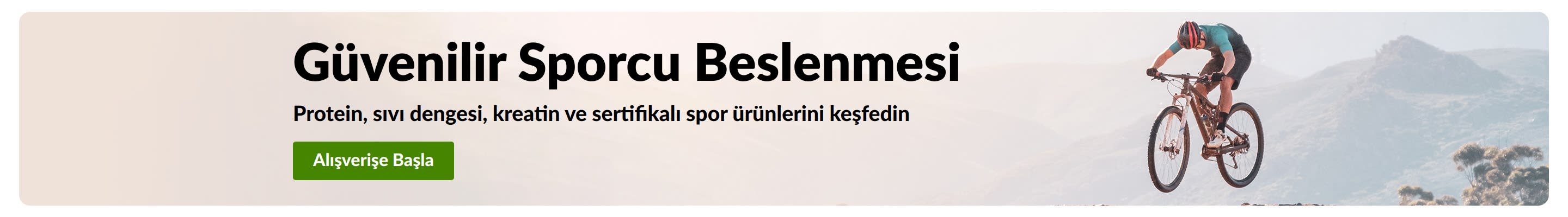 Protein, sıvı dengesi, kreatin ve sertifikalı spor ürünleri için Dağ Bisikletçisi görseli ve Şimdi Alışveriş Yap düğmesi içeren Güvenilir Sporcu Beslenmesi banner'ı.