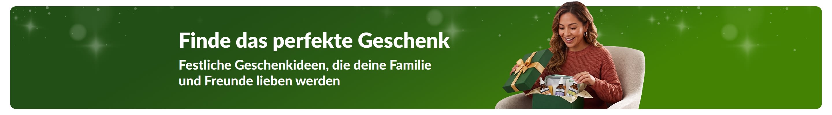 Finde das perfekte Geschenk. Festliche Geschenkideen, die deine Familie und Freunde lieben werden. Lächelnde Frau, die eine Geschenkbox öffnet.