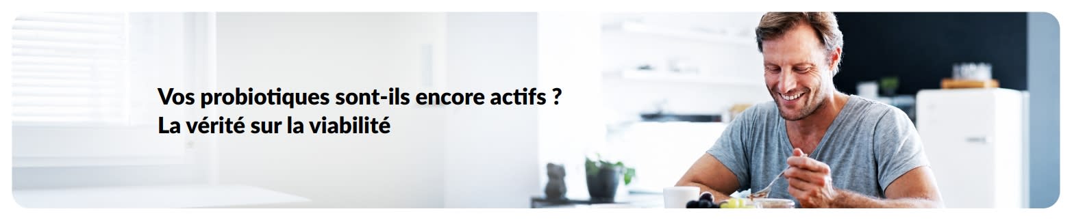 Bannière sur la viabilité des probiotiques avec un homme prenant son petit-déjeuner.