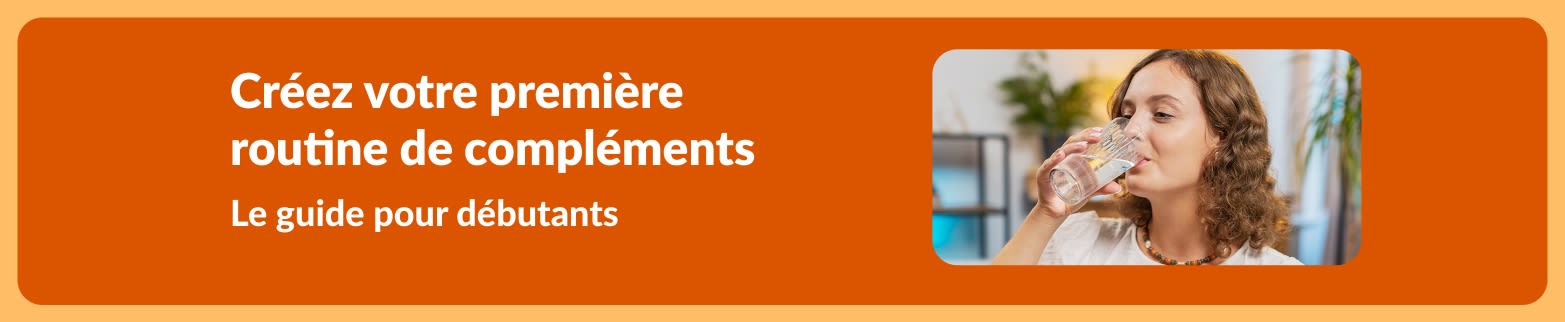 Guide débutant pour créer votre première routine de compléments, avec une femme prenant des compléments avec un verre d’eau.