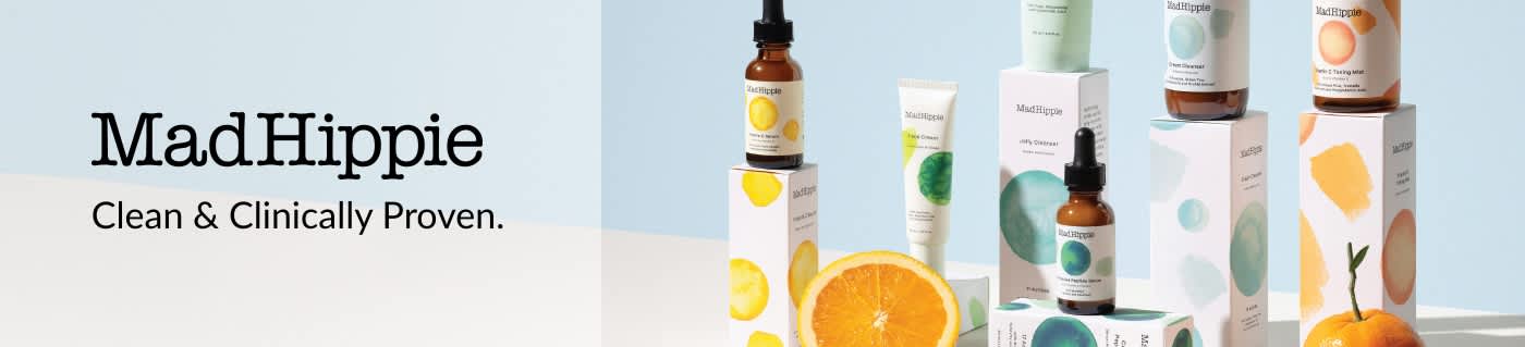 Mad Hippie skincare products displayed with fruit and minimalist packaging promoting clean, clinically proven formulas.