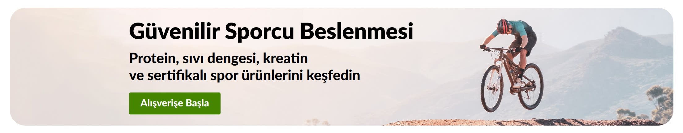 Protein, sıvı dengesi, kreatin ve sertifikalı spor ürünleri için Dağ Bisikletçisi görseli ve Şimdi Alışveriş Yap düğmesi içeren Güvenilir Sporcu Beslenmesi banner'ı.