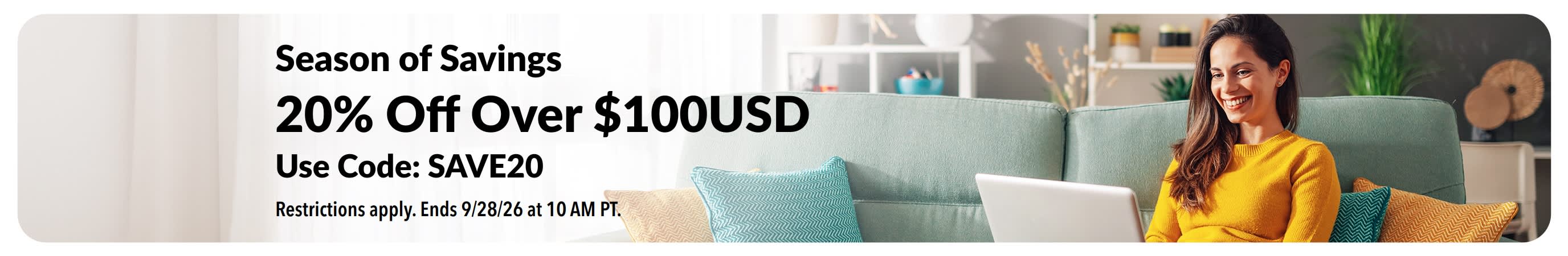 Season of Savings promo: 20% Off orders over $100USD with code SAVE20. Smiling woman using a laptop.