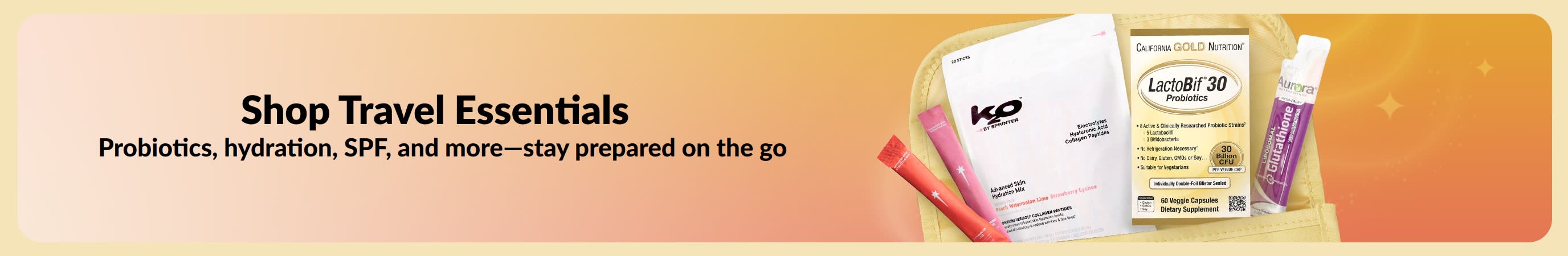 Multicolored banner with the message Shop Travel Essentials on one side and various travel products coming out of a toiletry bag on the other side.