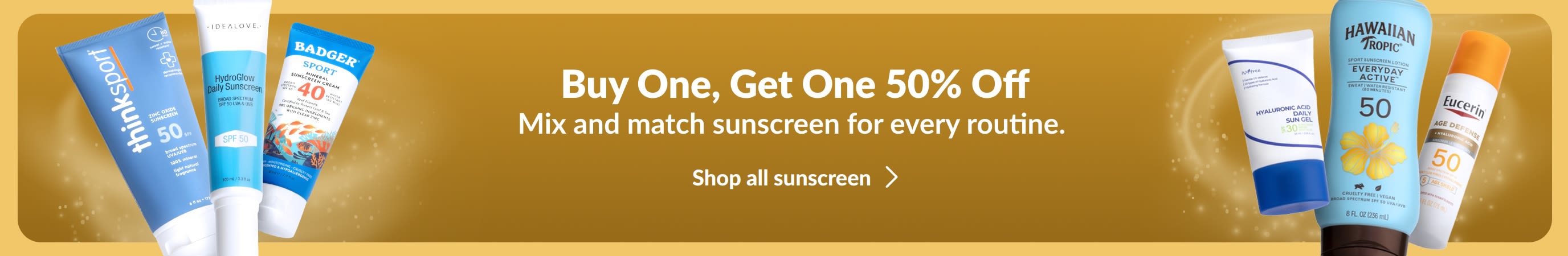 Two groups of various suncreen products on either side of a gold banner. Promotional copy on the banner says, 