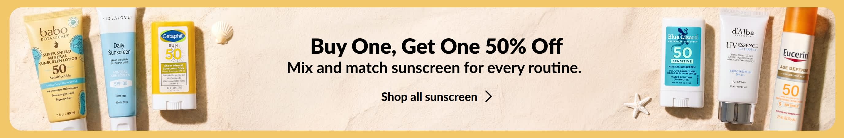 Two groups of various suncreen products on either side of a gold banner. Promotional copy on the banner says, 