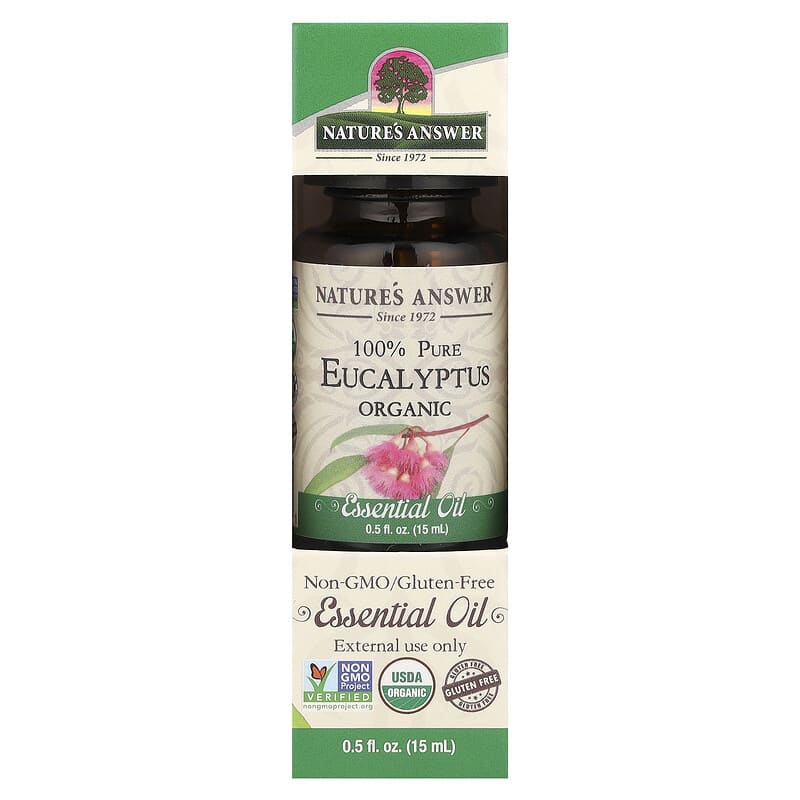 Olio Essenziale Dell'eucalyptus Del Limone Nella Bottiglia Ambrata, Con Le Foglie Fresche